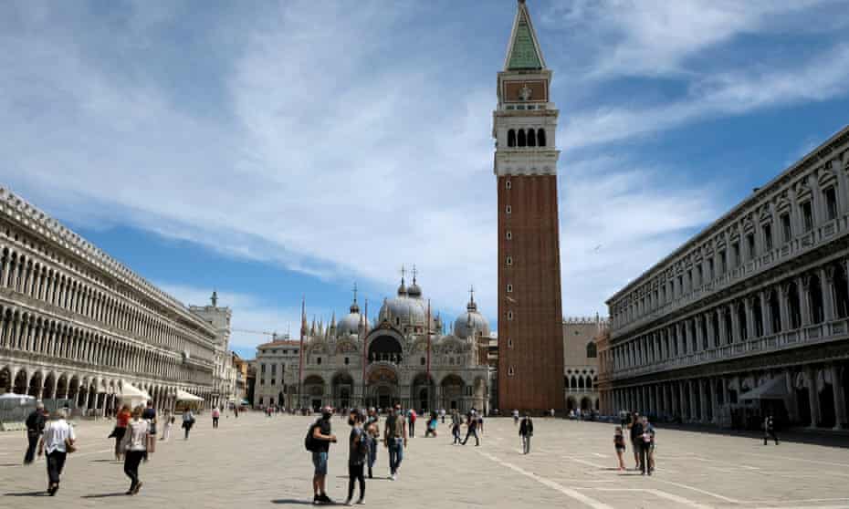  Tourists in an almost empty St Mark’s Square, Venice, this month. 
