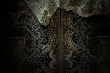 Rich Afghan rugs and drapery in the Ramazan home