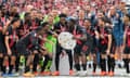Leverkusen's players celebrate with the Bundesliga trophy after their final-day win over Augsburg.