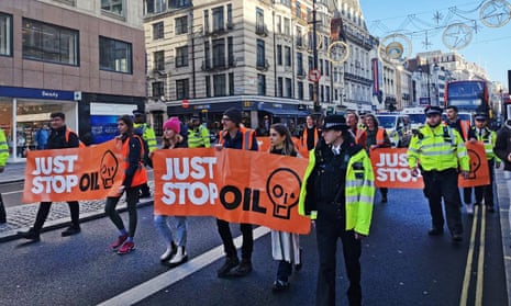 Just Stop Oil protesters block traffic in Aldwych, central London, on Monday