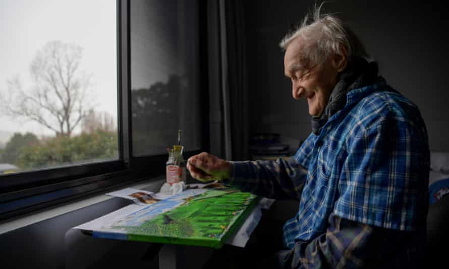 Jack Featherstone paints with a safety pin in time to classical music at Braidwood MultiPurpose Service in NSW.