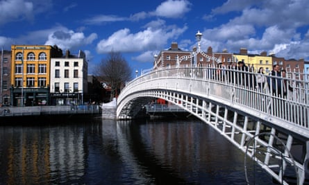 Daytime shot of the Ha’penny bridge that crosses the river Liffey in Dublin