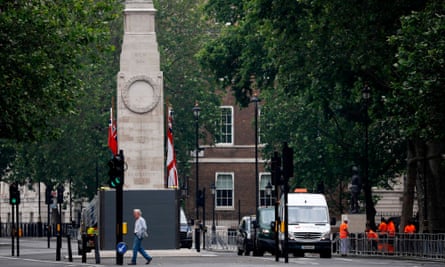 The Cenotaph war memorial in Whitehall, central London, being boarded up on Friday