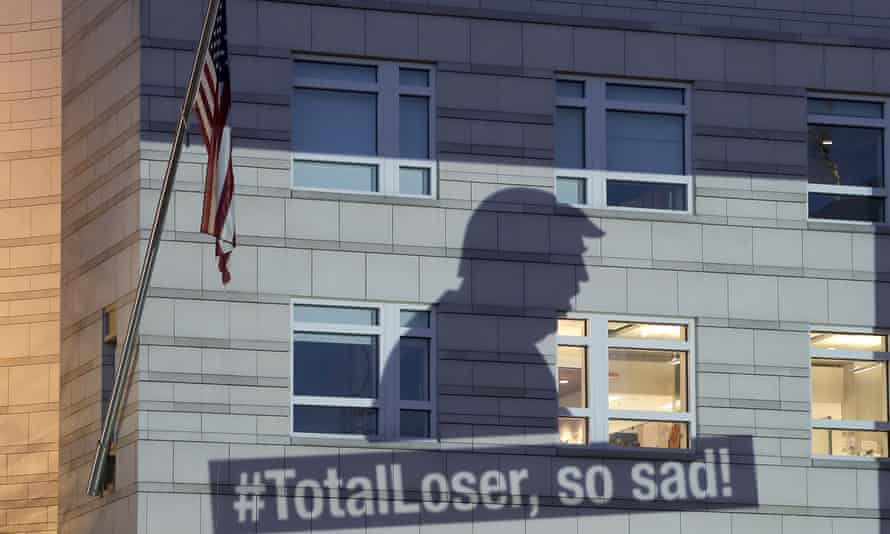 Revenge is tweet: an image of Trump is projected by Greenpeace on to the US Embassy in Berlin after he declared that America was pulling out of the Paris Climate Agreement.