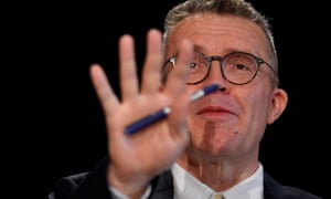 LabourĂ¢s deputy leader, Tom Watson, holds his hand up in front of his face.