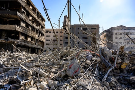 Puffs of smoke rise from the destroyed buildings after a series of Israeli airstrikes that Israel says killed Hashem Safieddine in Beirut.