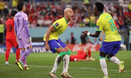 Richarlison (l) and Vinicius Junior (r) celebrate after Lucas Paqueta of Brazil (not pictured) scored their sides fourth goal during their victory against South Korea