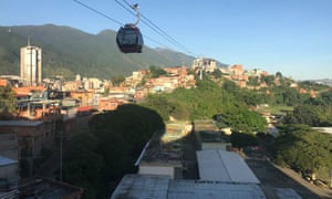 A cable car passes above San Agustín