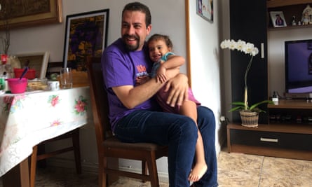 Boulos hugs the niece of murdered Rio councillor Marielle Franco during a recent visit to her family home.