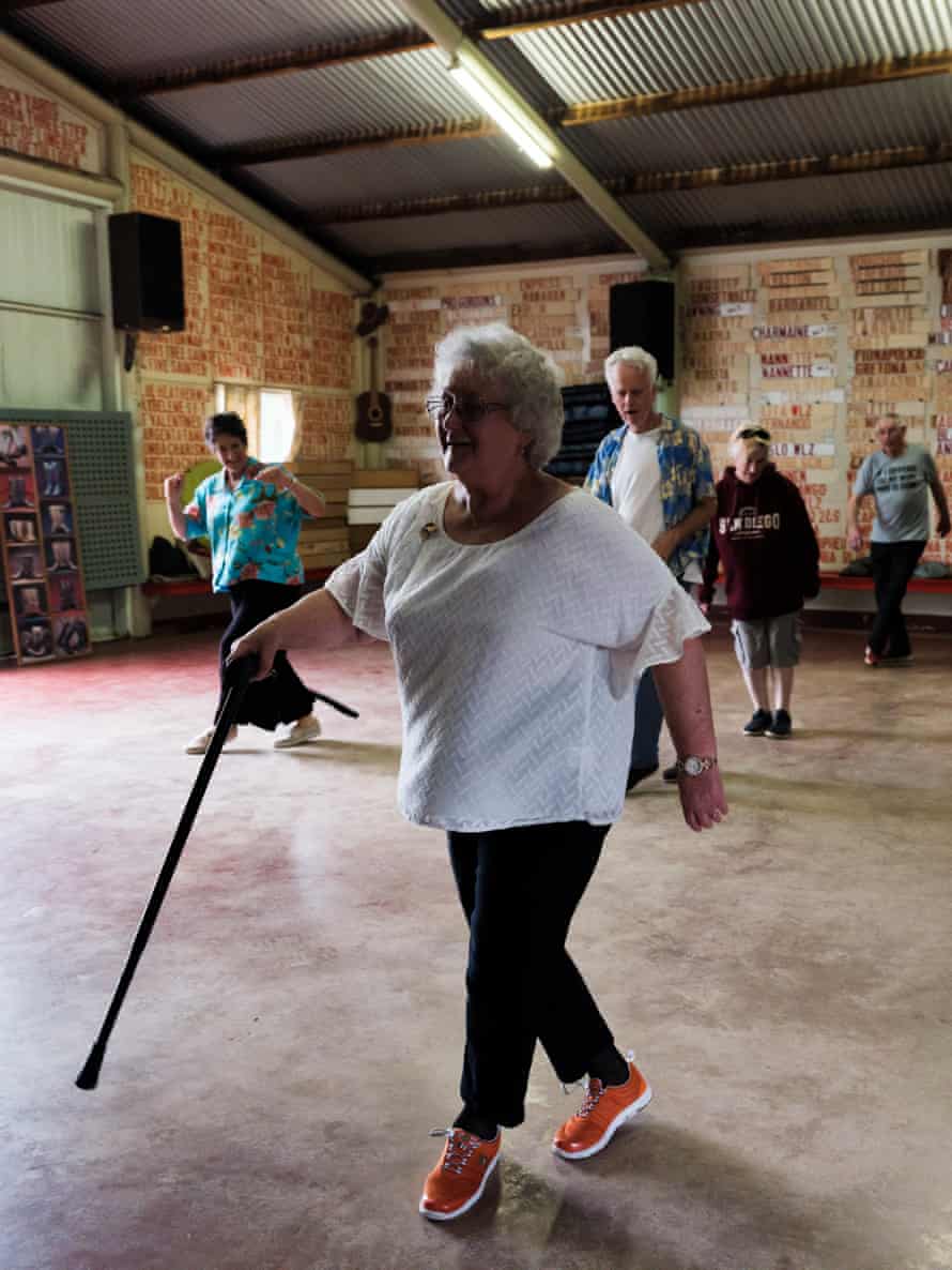 Barbara Hill, 80, teaches the step sequence to a class of beginners.