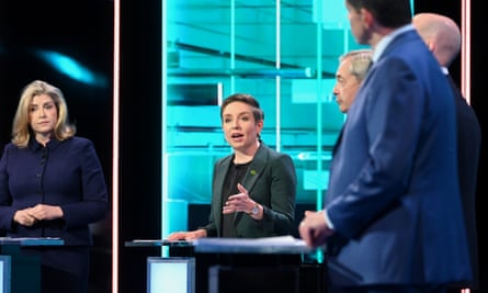 Carla Denyer speaking during an ITV debate, flanked by Penny Mordaunt and Nigel Farage