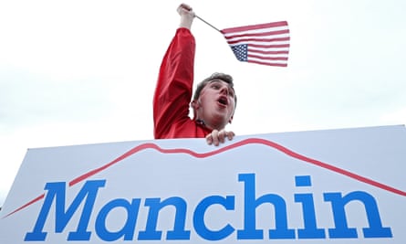 A supporter holds a Manchin sign in Charleston, West Virginia, on 6 November.