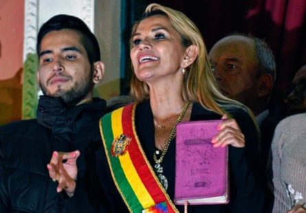 Bolivia’s self-proclaimed interim president, Jeanine Áñez, a conservative Christian, speaks from the balcony of the Quemado Palace in La Paz with a Bible in hand.