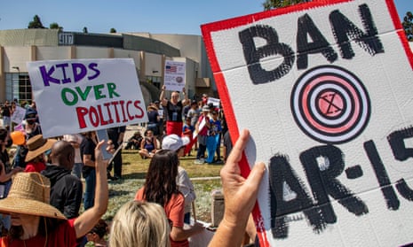 People carry signs at a March for Our Lives rally in Culver City, California. 