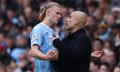 Pep Guardiola speaks with Erling Haaland as he leaves the pitch after being substituted against Wolves last week. 