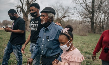 Clyde Robinson walks with his grandkids on his land in south-west Memphis. Robinson is one of the landowners being sued for property rights of their land by the Byhalia Connection pipeline project.