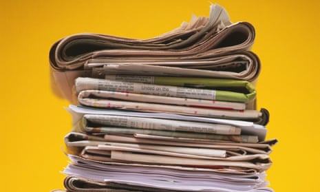 Pile of folded newspapers, front view.