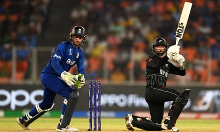 Devon Conway picks up runs while Jos Buttler looks on.