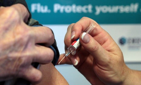 A man is given a flu jab