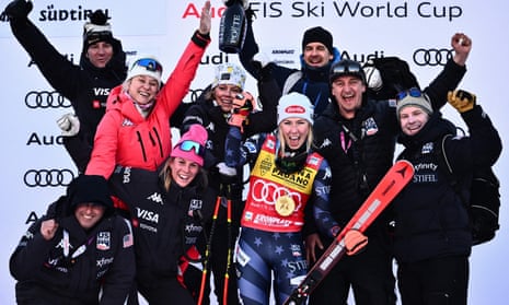 Mikaela Shiffrin celebrates with her team after her victory in the giant slalom