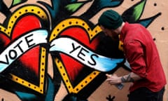A graffiti artist finishes a Yes campaign piece in central Dublin in Ireland before the referendum on same-sex marriage. 