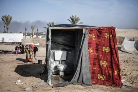 A view of a toilet in a tent.