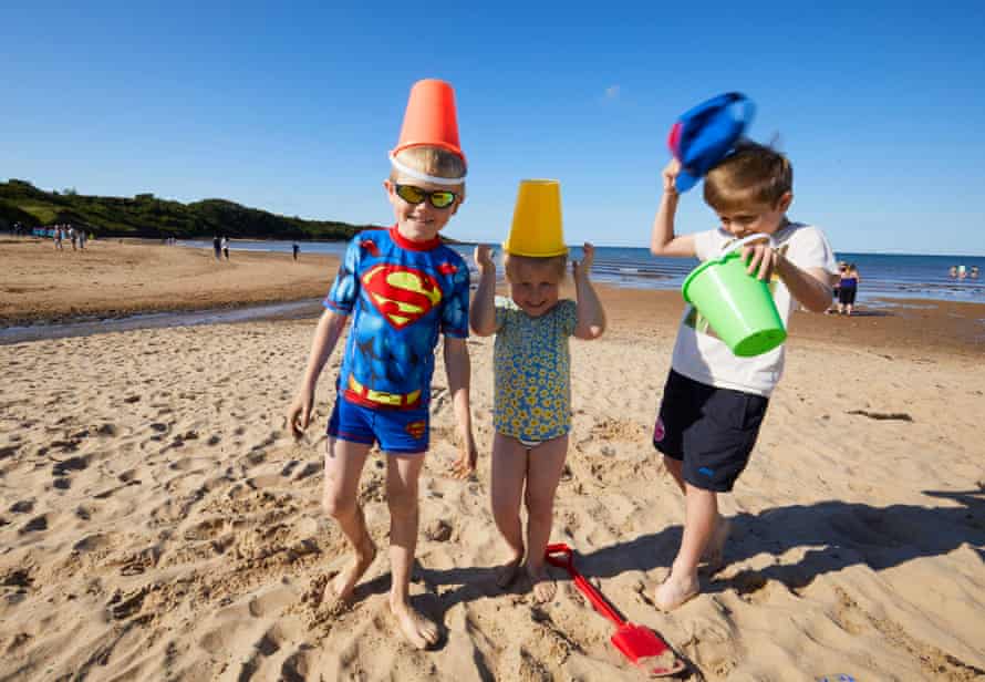 Seven-year-old Luca Petersen dressed as Superman on Lligwy Bay beach