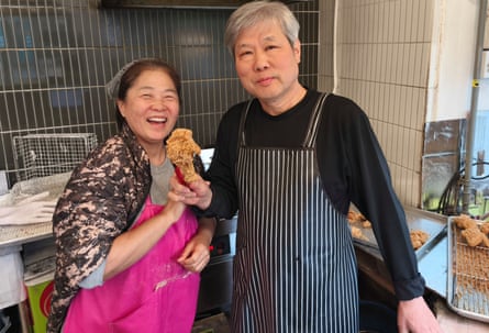 Kim Ki-deuk and his wife Baek Hye-kyeong at their shop near Korea University in Seoul.