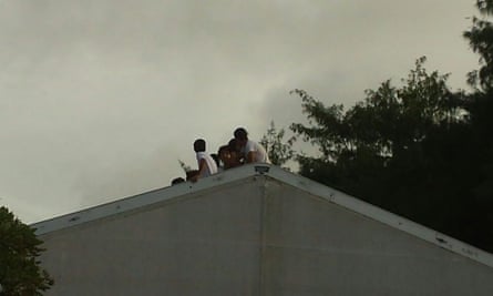 Teenage boys on top of the roof of a tent in RPC3 during fortnight-long protests by refugees and asylum seekers in Nauru
