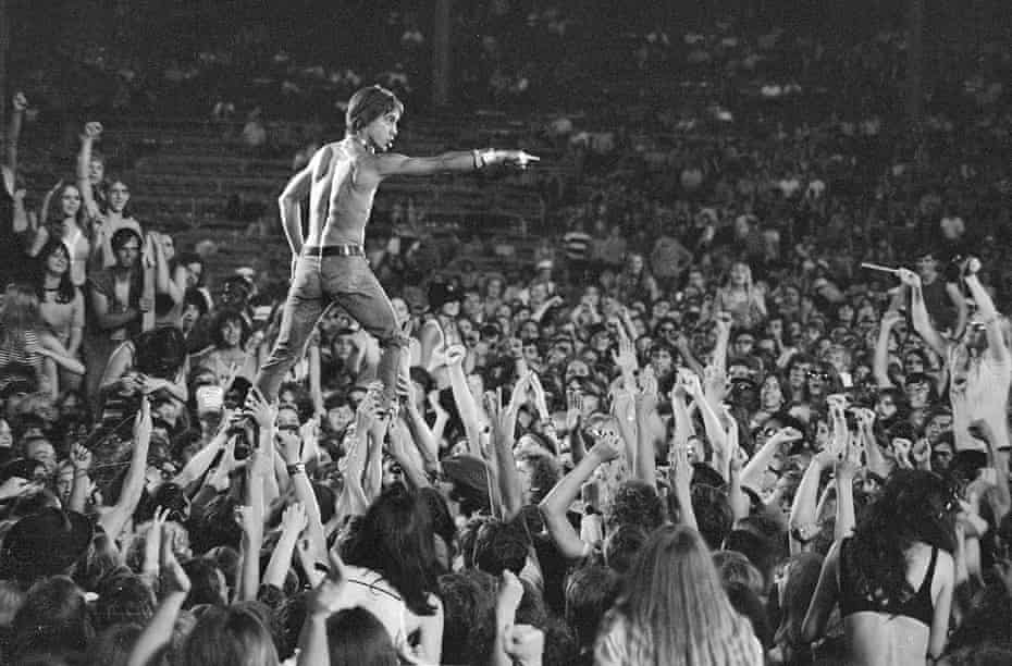 Iggy Pop rides the crowd during a Stooges concert at Crosley Field, Cincinnati, on 23 June 1970.