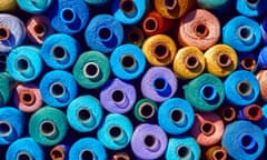 Composition of sewing spools with colorful vibrant threads from above<br>GettyImages-1305265377