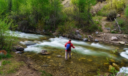 Man crossing a stream