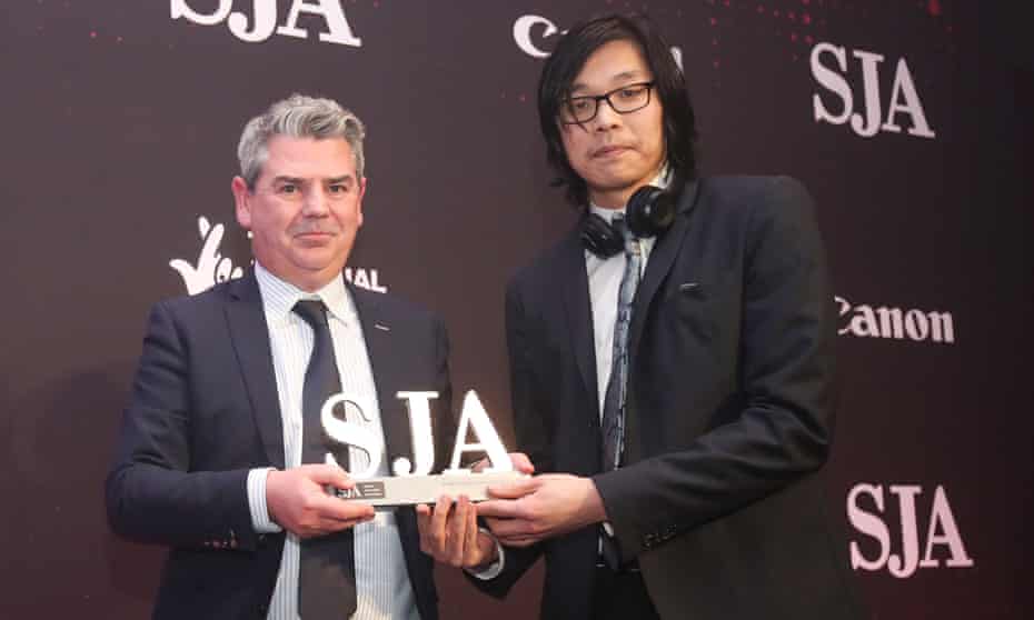 Jonathan Liew collects his award.