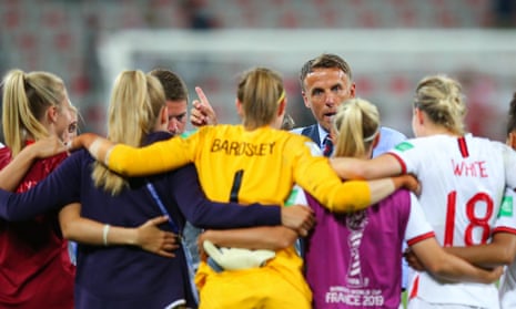 England manager Phil Neville talks to his players after the final whistle.