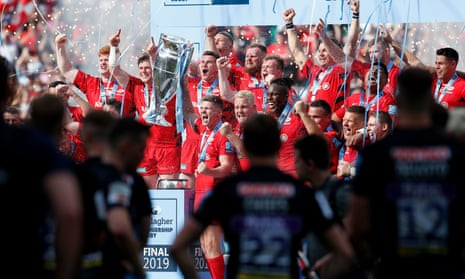 Saracens’ Owen Farrell (centre) lifts the trophy with his team-mates as they celebrate winning the Gallagher Premiership Final.
