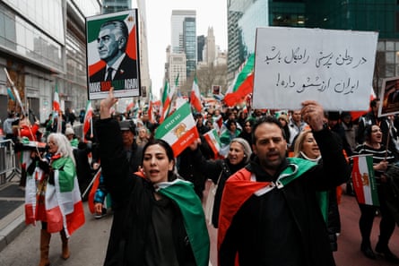 Protesters in New York hold aloft an image of Reza Pahlavi, the exiled son of Iran’s last shah, at an anti-regime march