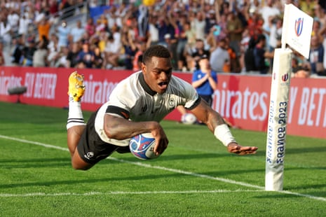 Josua Tuisova of Fiji scores his team's first try.