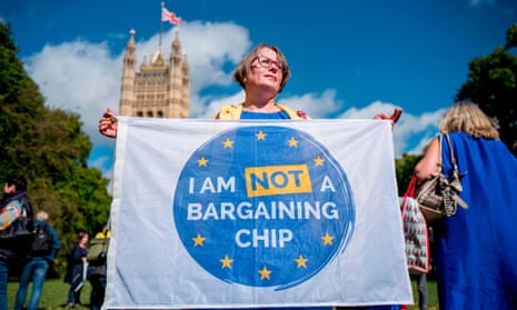A demonstrator holds a banner at an EU citizens’ rights protest in September 2017