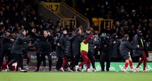 Liverpool manager Jürgen Klopp celebrates with substitutes and coaching staff after Divock Origi scored their first goal.