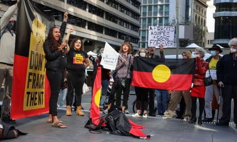 Activists protest plans to frack the Northern Territory's Beetaloo Basin, outside the Empire Energy offices in Sydney in May 2021