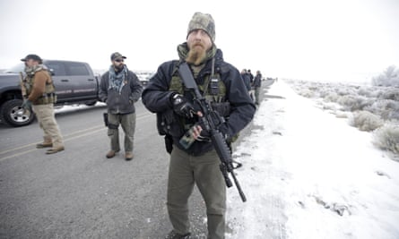 A man stands guard at the Malheur national wildlife refuge in Oregon to protest federal land use policies.