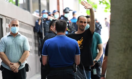 Mostafa ‘Moz’ Azimitabar waves as he leaves the Park hotel in Melbourne in January 2021 after his release from hotel detention