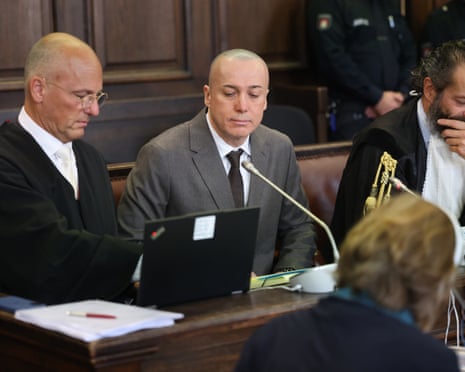 Serhii Kuznietsov, centre, a former Ukrainian army officer, attends a trial at the Hanseatic Higher Regional Court in Hamburg, Germany.