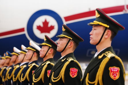 A Chinese honour guard awaits the departure of Canada’s prime minister, Mark Carney, at Beijing airport