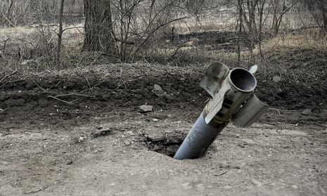 A view of an unexploded bomb near a road near Chasiv Yar.