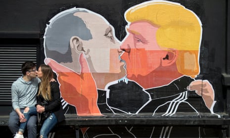 Street art in Vilnius old town depicting Vladimir Putin and Donald Trump in a clinch.
