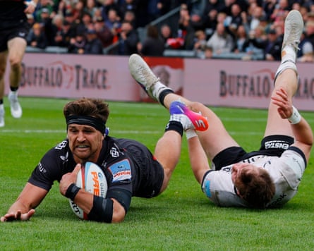 Henry Slade jumping over the try line, ball in hand