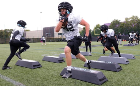 Edgar Wallen, a running back from Sweden, carries the ball in a drill during a training session for the NFL Academy at Loughborough University.