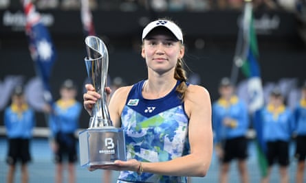 Elena Rybakina poses with the Brisbane International trophy after beating Aryna Sabalenka