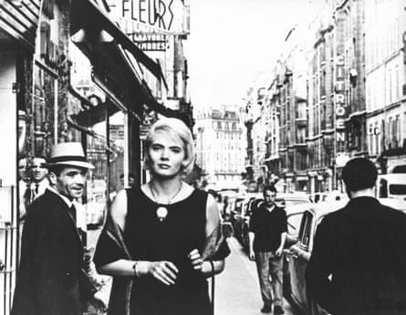 Actor Corinne Marchand walks down a street in Paris in the film Cléo from 5 to 7, made in 1961
